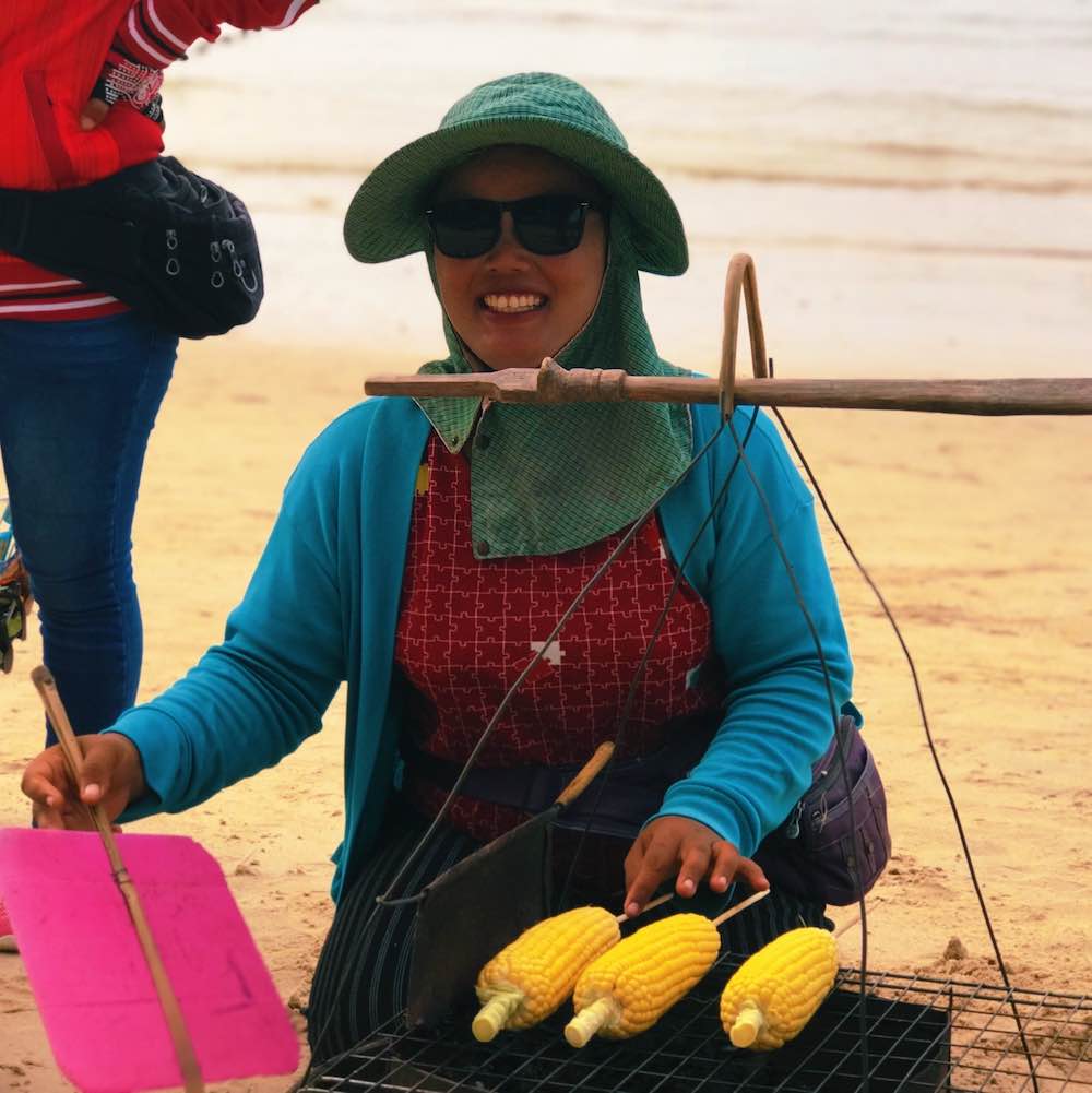 A lovely Thai lady selling corn on the beach