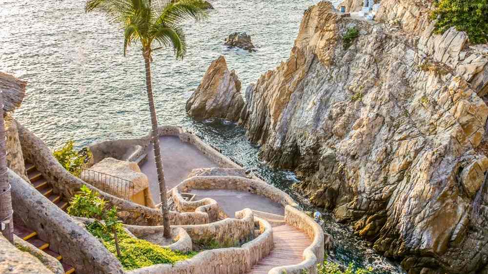 staircase made of stone going down to the ocean near the cliff -25 Best Places to Visit in Mexico