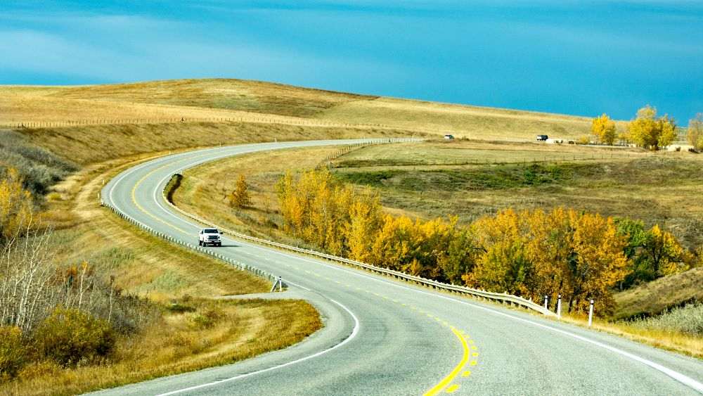 curvy long highway road - Best road trips in the world