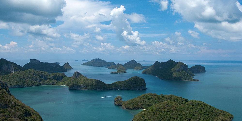 blue beach with small islands