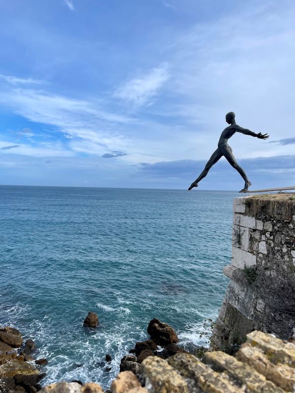 man woman. bronze sculpture  on top of the ocean