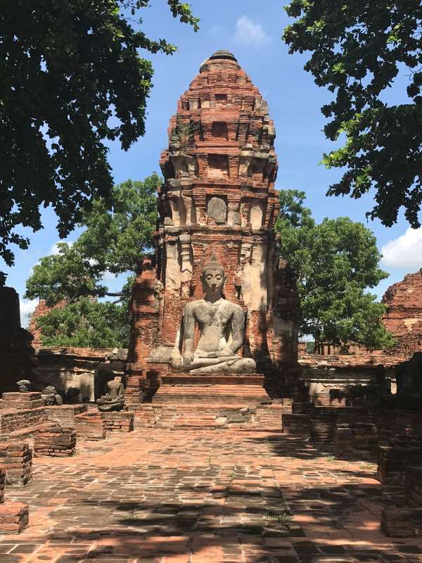 brown concrete like structure with buddha statue