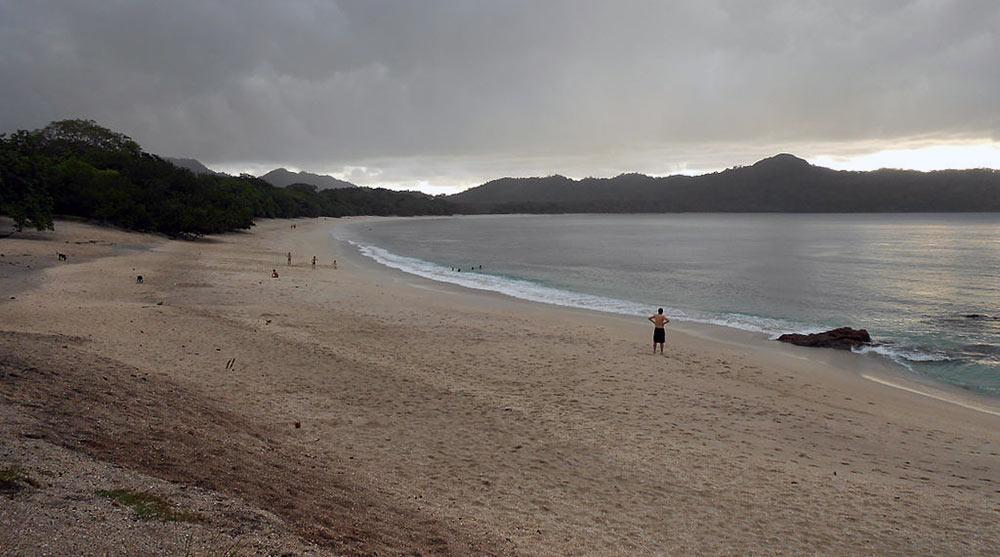 People in the beach with stunning pink sand at the Playa Conchal Beach, Guanacaste