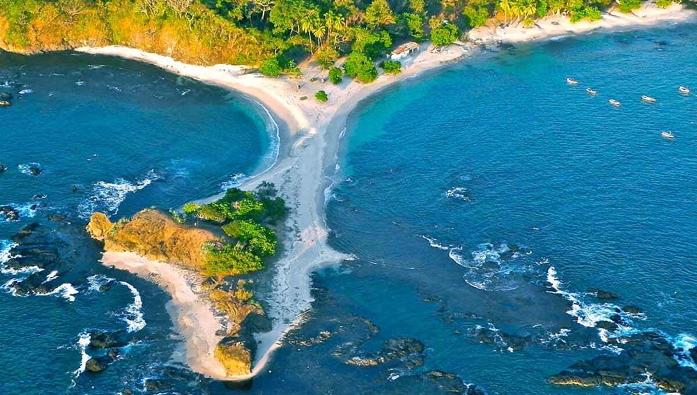  two beaches meet and merge with white sand and trees at the San Juanillo Beach, Nicoya Peninsula 