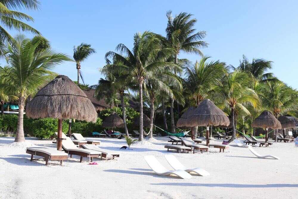 Nipu huts serve like an umbrella with white beach beds