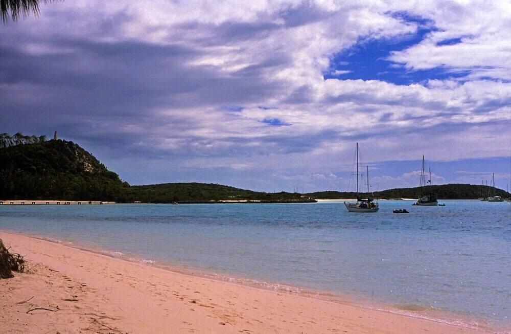 boats sailing on the beach in Stocking Island Beach