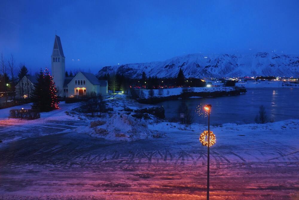 snow all over and christmas lantern showing Christmas in Iceland