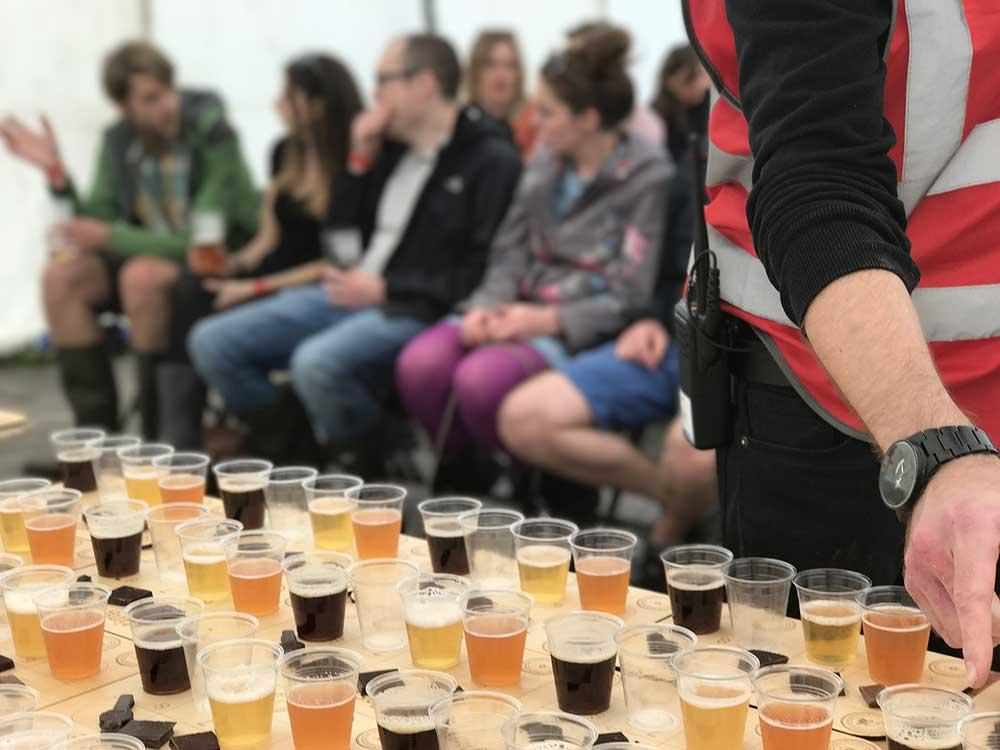 locally-brewed beer in plastic cups for smapling during the san francisco beer festival