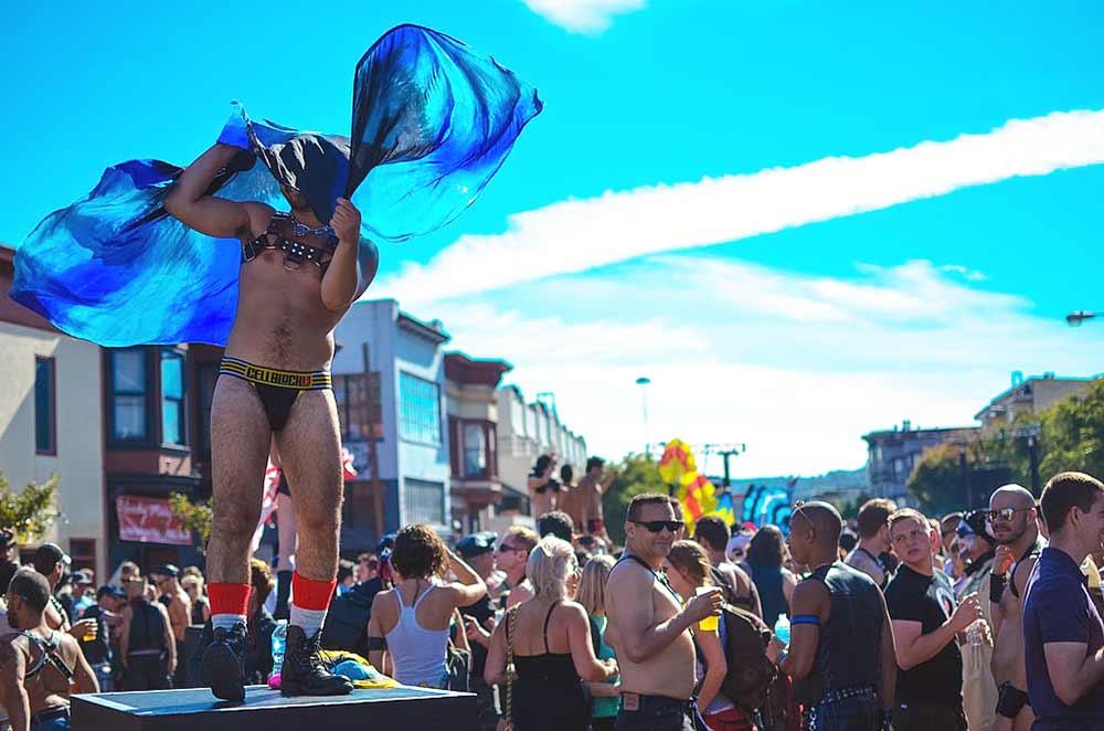 revelers jampacking a street show during the san fancisco folsom street fair