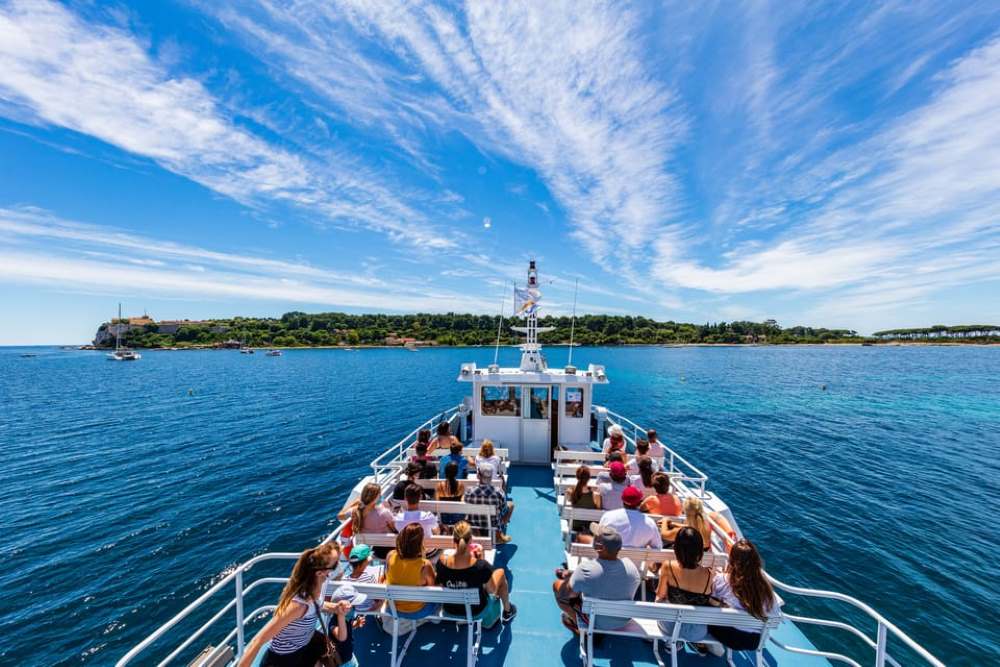 group of people sailing in the middle of the ocean - Best Things to Do in Cannes