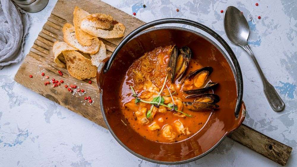 French seafood stew made of fish, shellfish, onions, tomatoes, white wine, olive oil, garlic, saffron and herbs.- Best Things to Do in Antibes