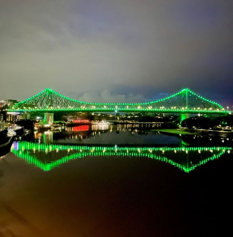 story bridge with green lights during night time
