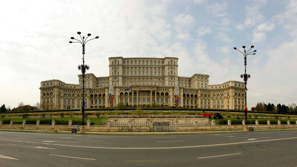 wide concrete building in front of the street-romania digital nomad visa