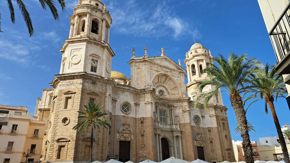 huge cathedral beside some palm trees
