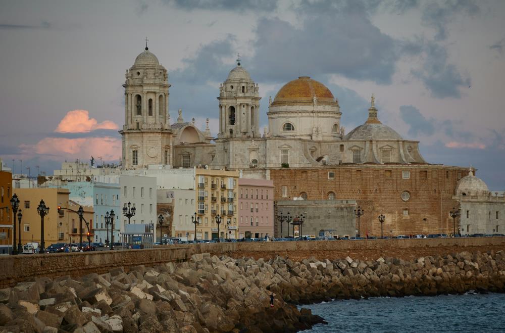 old town showing buildings and cathedral near body of water - Oldest Cities in the World to Visit in 2025