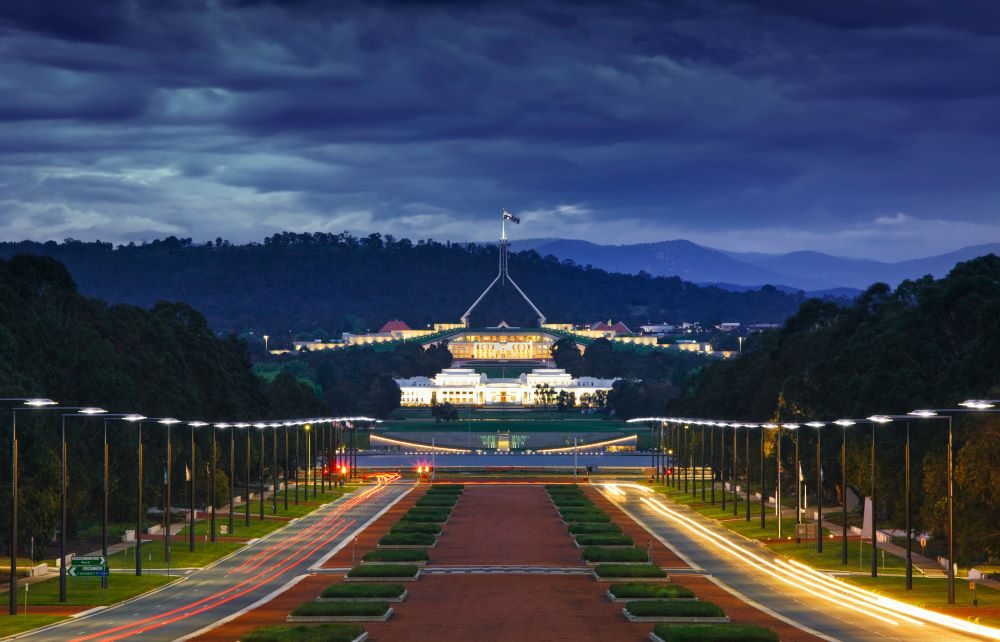 brown concrete pathway going to the building known as Parliament House