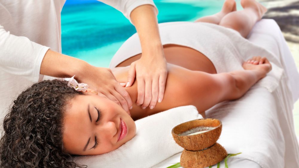 woman having back massage near the beach- Best Things to Do in Cancun Mexico