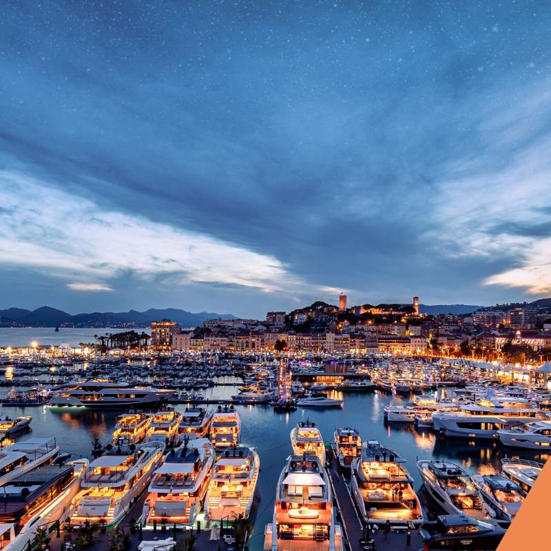 light up yacht and boats at the ocean near the dock -Best Things to Do in Cannes