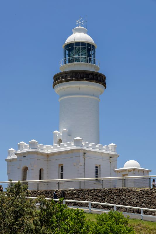 white lighthouse on top of the hill