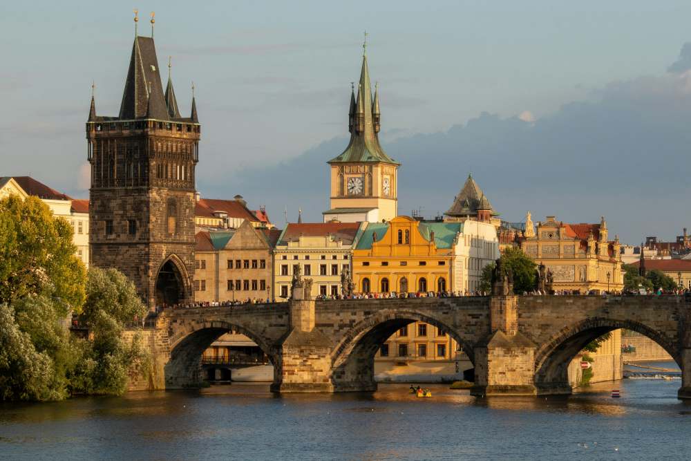 bridge above the body of water near an old town - best cities for nomads