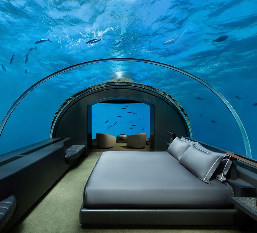bed underwater showing fishes around - unique hotels in the world