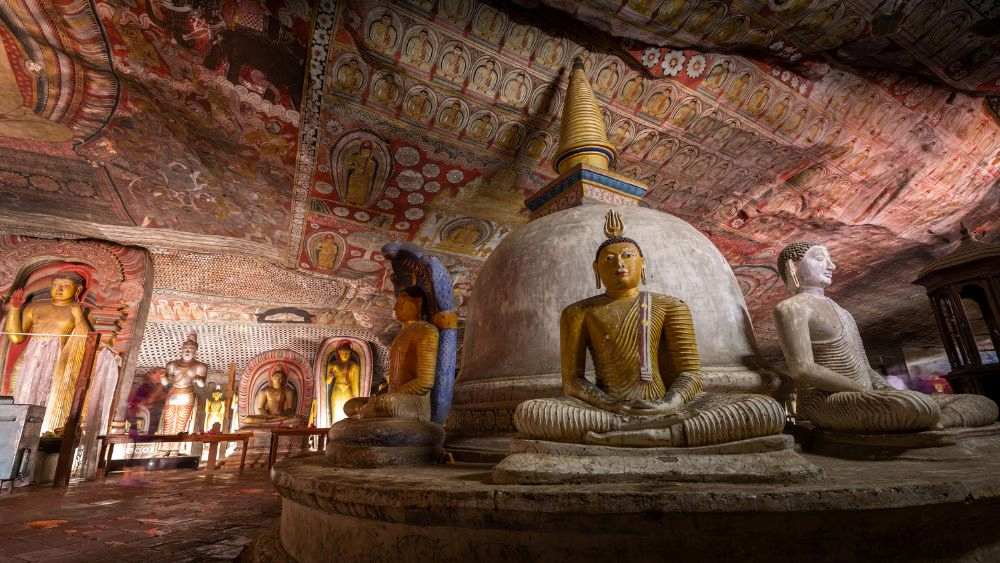 buddha statue inside a cave temple
