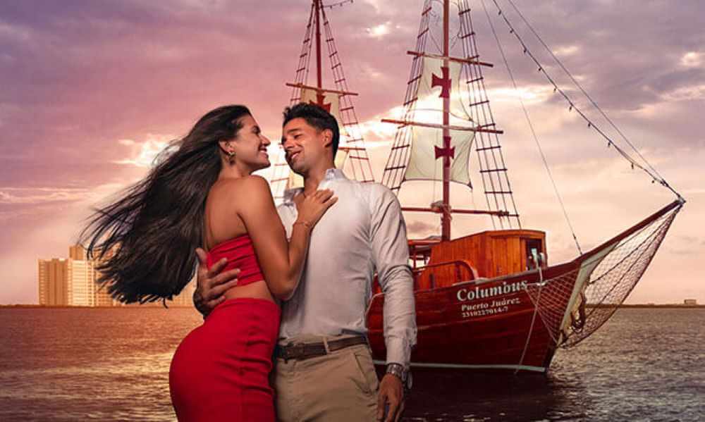 couple in fancy dress hugging and looking at each other with boat on their back- Best Things to Do in Cancun Mexico