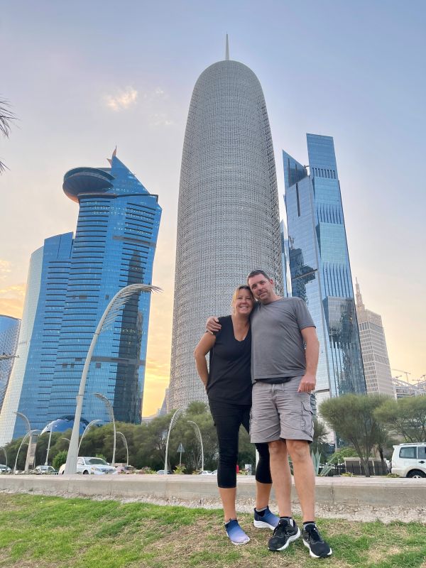 husband and I in front of high rise buildings
