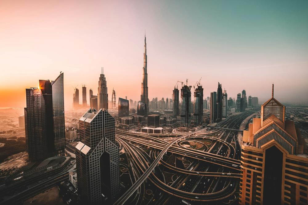 aerial photo of the city showing high rise buildings and highways -dubai digital nomad visa