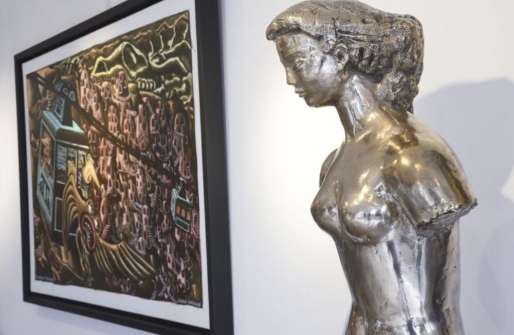 silver statue of a woman without arms beside a painting - Best Things to Do in Cannes