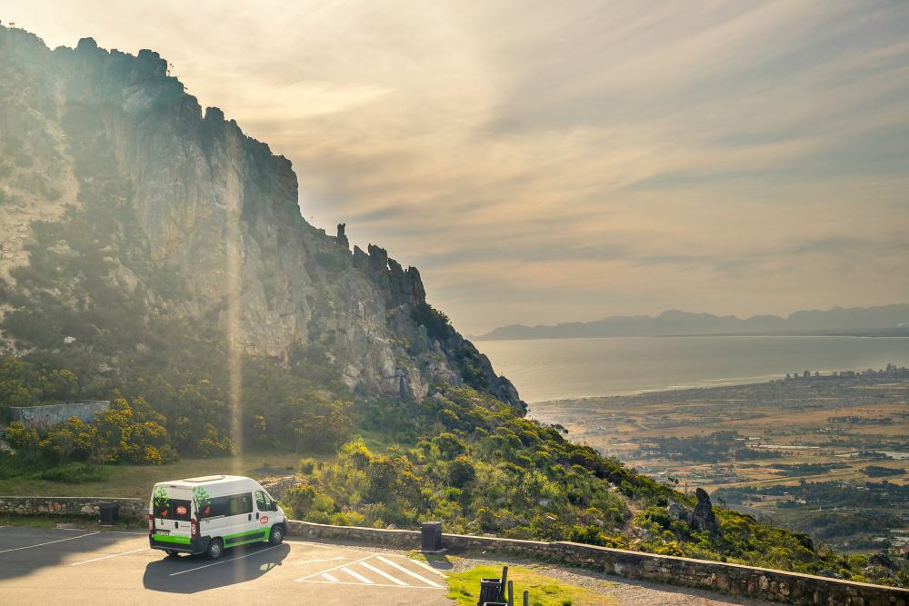 van on side of the road showing stunning view of mountain