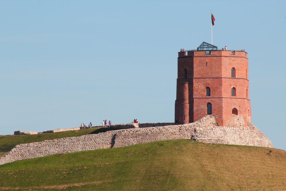 pink bricks building tower on top of a hill