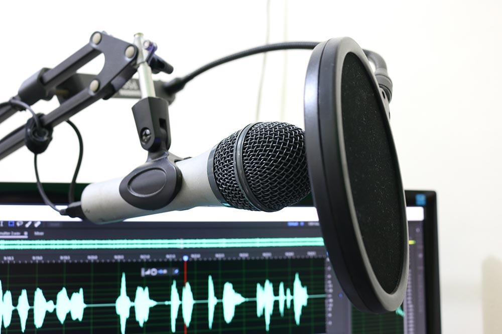 Image of a hightech Microphone with computer set up used for voice over