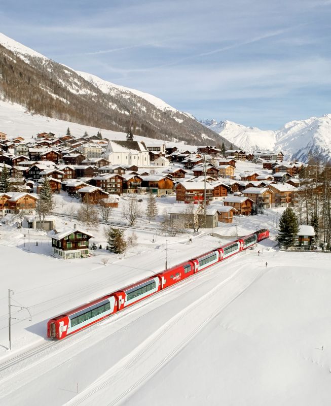 aerial view of red train during snow time