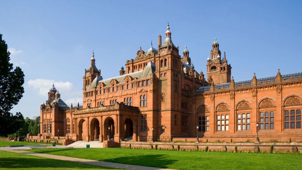 wide orange building with grand Victorian architecture design- Things to Do in Scotland