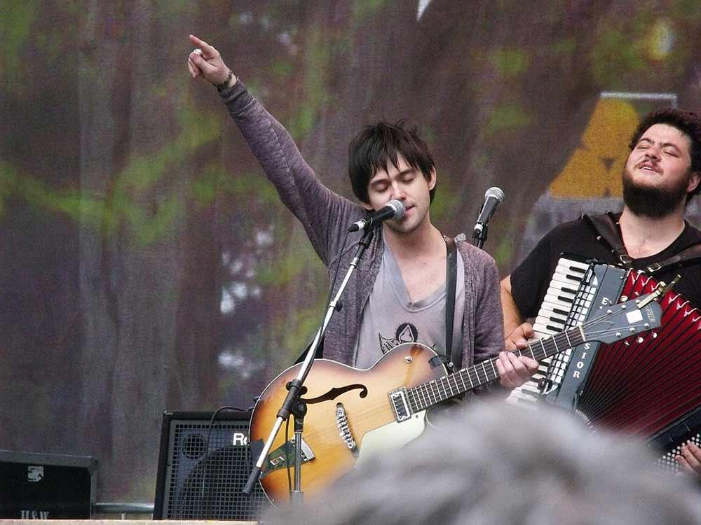 two performers playing music onstage during the hardly strictly bluegrass festival in san francisco