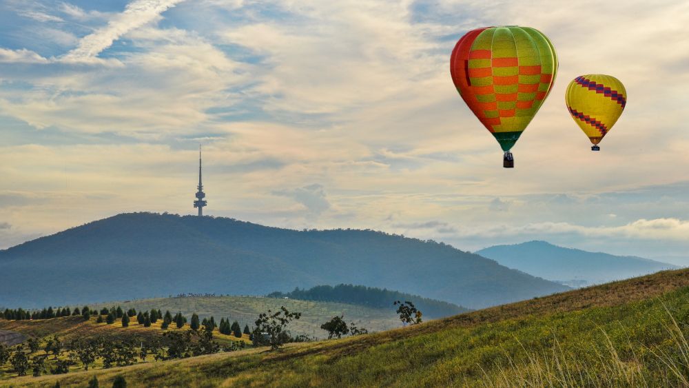 two Hot Air Balloon on top of a field