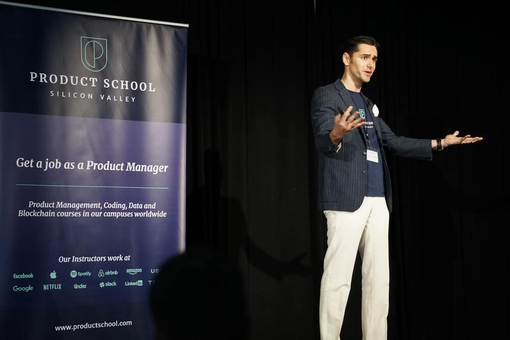 Image of a man in stage who is a consultant coach