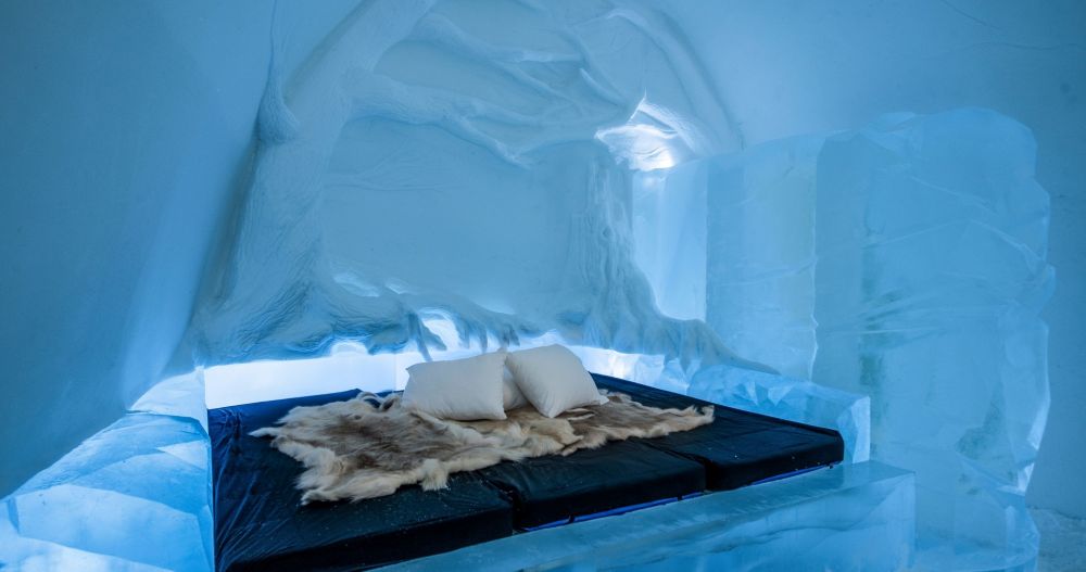 foam bed on top of ice made bed frame inside the ice made room - unique hotels in the world