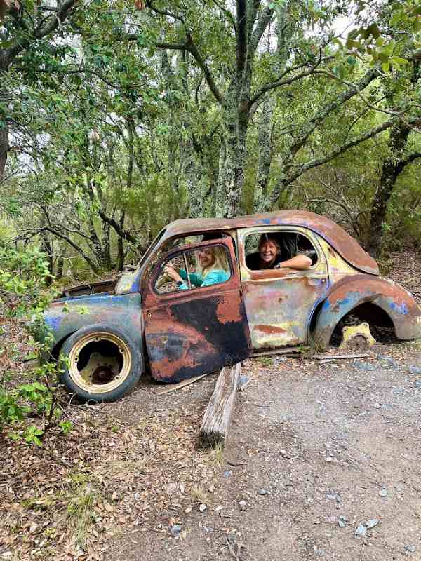 friend and I image at an old vintage ruin car