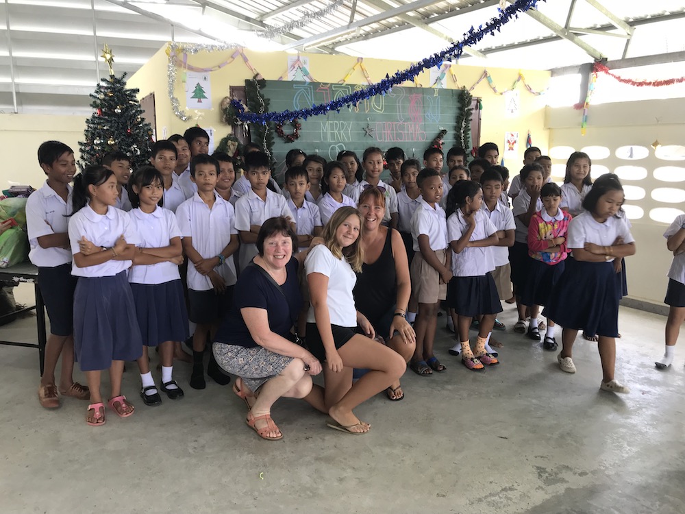 taking picture with local student during christmas party
