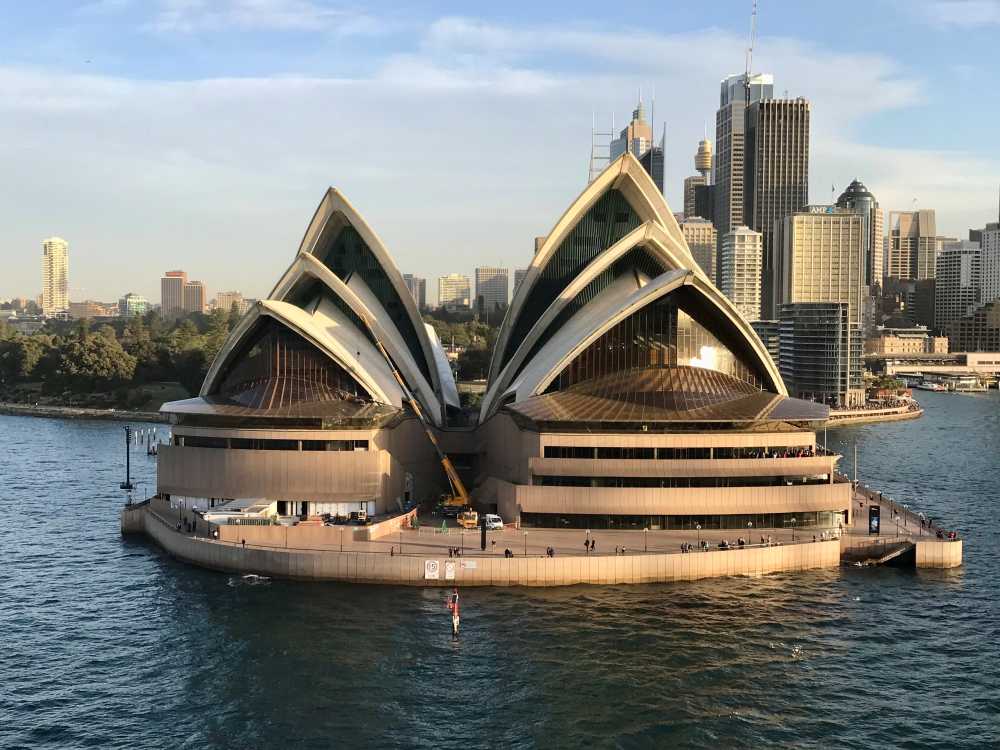 image of Sydney Opera House surrounded by the ocean water