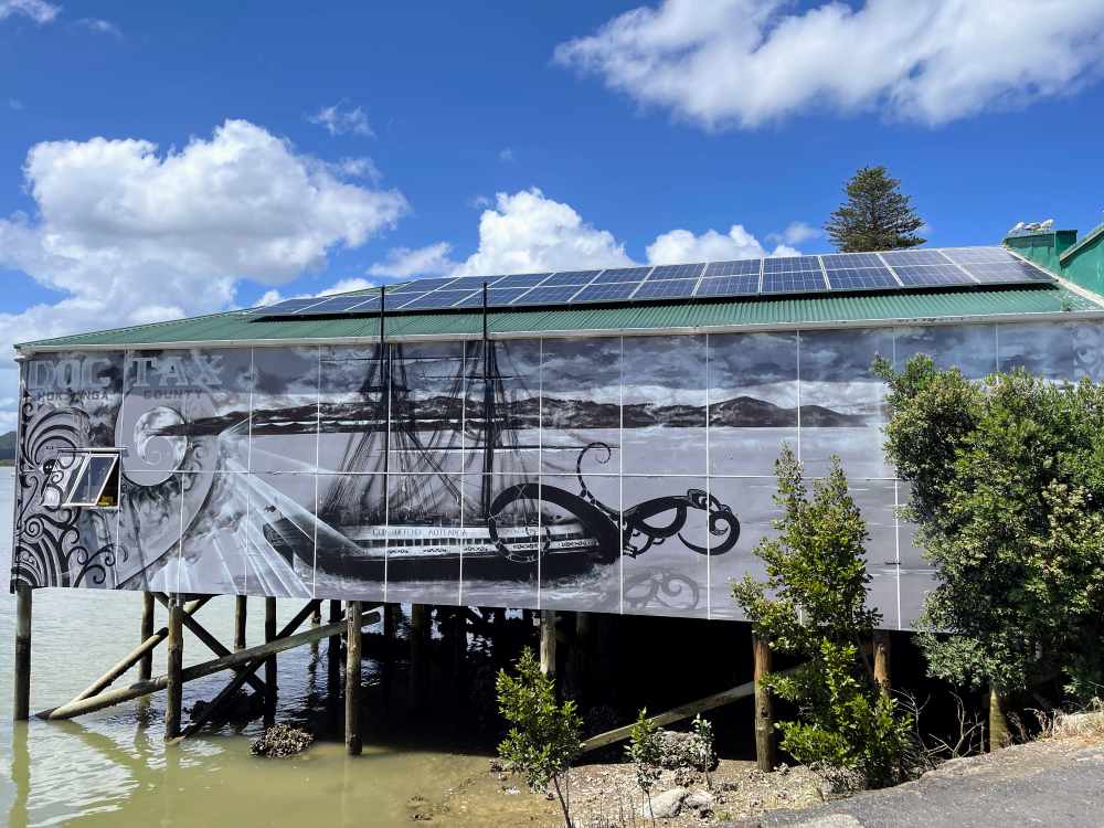 house made with wood with picture of an old ship