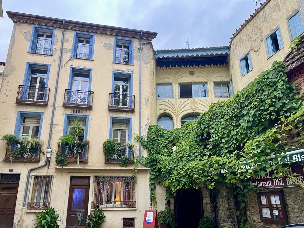 yellow building with plants design