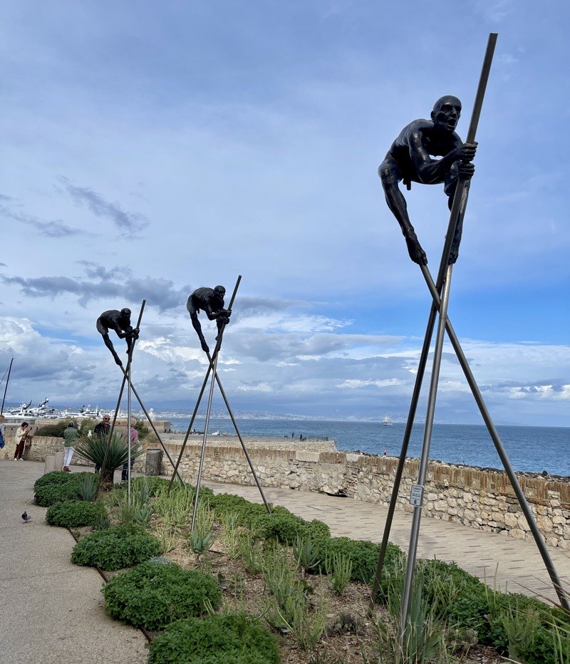 black men statue holding large sticks