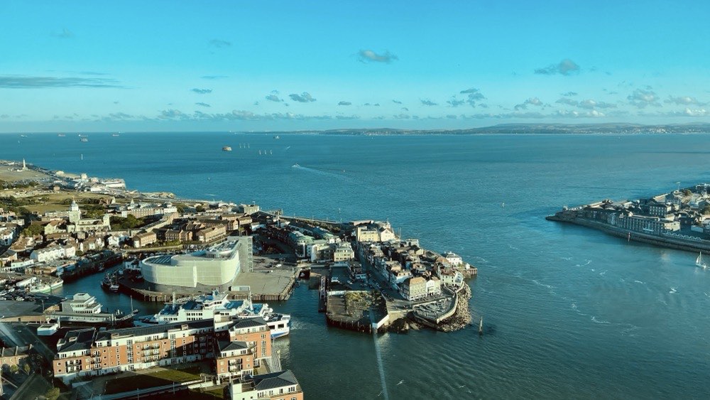 aerial view of the city surrounded by body of water