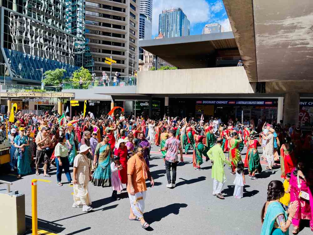 Indians in colorful dresses outside the street