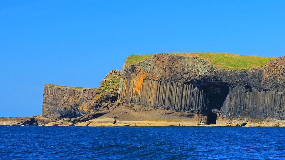 cave beside the blue ocean