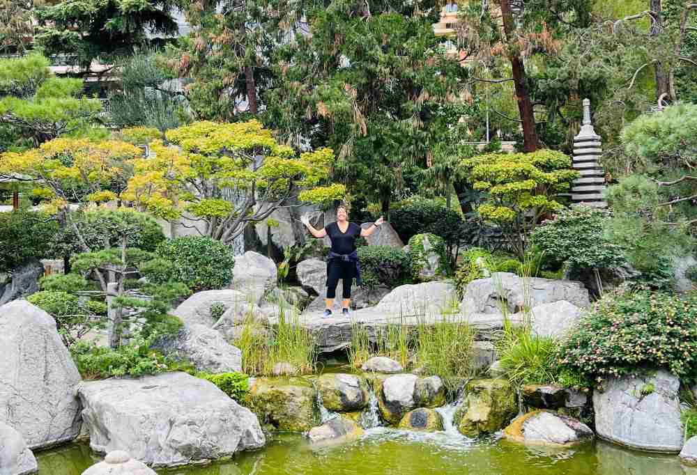 my  picture in the middle of the Japanese Garden surrounded  by stones and trees - Things to do in Monaco 