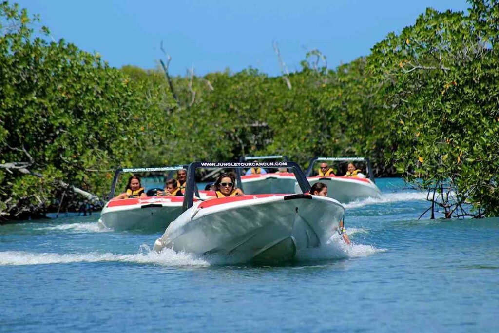 group of people riding speadboat touring at the jungle of Cancun
